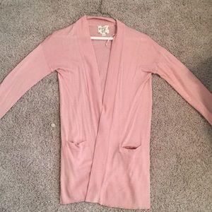 A pale pink womens light cardigan